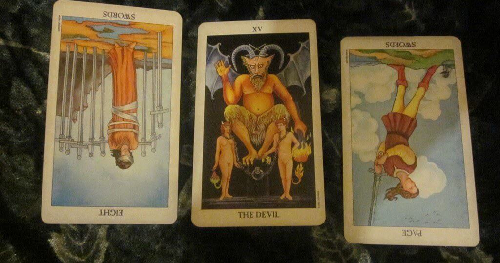 09/07/11: Obsession | Rev. Eight of Swords, Devil, Rev. Page of Swords Everyday Tarot